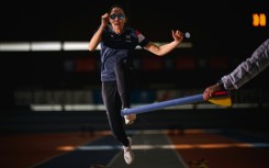 Delya Boulaghlem, a French visually handicapped sprinter and long jumper, takes part in a training session in preparation for the Paris Paralympics