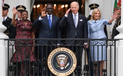 (L-R) First Lady Rachel Ruto of Kenya, Kenyan President William Ruto, US President Joe Biden and First Lady Jill Biden wave to the crowd during an official arrival ceremony on the South Lawn of the White House in Washington, DC, on May 23, 2024