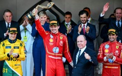 Charles Leclerc celebrates his first home Monaco Grand Prix alongside his Principality's head of state, Prince Albert II