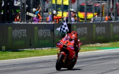 Ducati rider Francesco Bagnaia crosses the finish line in first place at the Catalunya MotoGP on Sunday