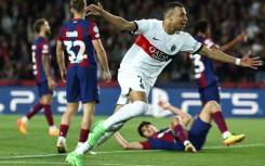 Paris Saint-Germain's French forward Kylian Mbappe netted twice against Barcelona at Montjuic in the Champions League