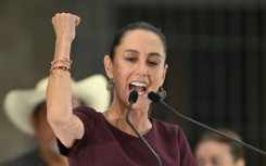 Mexican ruling party presidential candidate Claudia Sheinbaum shows her inked finger as she votes