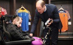 Prince William meets with Rob Burrow (L) at Headingley Stadium in 2024