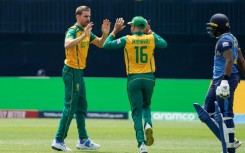 South Africa's Anrich Nortje (L) celebrates after dismissing Sri Lanka's Kamindu Mendis (R) as the paceman took 4-7 in South Africa's 6-wicket win over Sri Lanka at the T20 World Cup