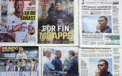 This picture taken on June 4, 2024 shows several Spanish newspapers' front pages a day after French forward Kylian Mbappe signed for Real Madrid