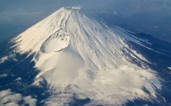 Tourists are flocking to take photos of Japan's highest peak Mount Fuji