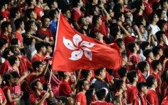 In this picture taken in 2017, Hong Kong fans hold their flag during a match