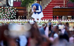 India’s newly sworn-in Prime Minister Narendra Modi bows his head to the crown after taking the oath of office for his third term