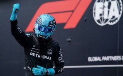 Mercedes' British driver George Russell celebrates winning pole for the Canada Grand Prix 