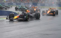 Max Verstappen leads Lando Norris as the spray flies at the Canadian  Grand Prix