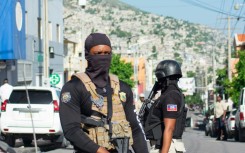 Police outside the hospital where Haiti's Prime Minister Garry Conille was briefly hospitalized in Port-au-Prince