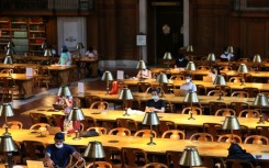 People read their computers in the New York Public Library in July 2021 in Manhattan 