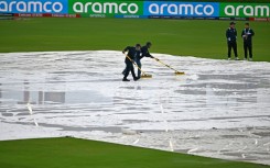 Match officials wipe water from the pitch but the ICC men's Twenty20 World Cup 2024 group D cricket match between Sri Lanka and Nepal at Central Broward Park was ultimately called off