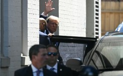 Former US president Donald Trump waves as he departs the Capitol Hill Club following a meeting with US House Republicans on Capitol Hill in Washington, DC, on June 13, 2024