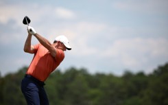 World number three Rory McIlroy of Northern Ireland shared the lead when he teed off in Friday's second round of the 124th US Open at Pinehurst