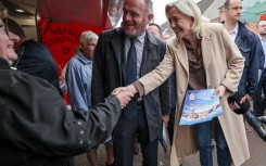 French far-right figurehead Marine Le Pen meets local residents during a campaign visit to the northern town of Henin-Beaumont