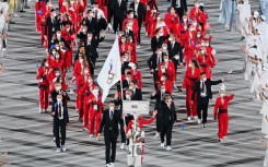 After a drugs scandal, Russian competitors at the Tokyo Games marched at the opening ceremony behind the Russian Olympic Committee flag