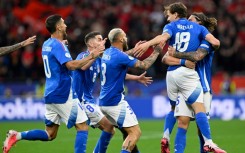 Italy players celebrate with Nicolo Barella after he scored what proved to be his side's winner against Albania