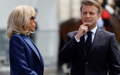 France's President Emmanuel Macron and his wife Brigitte Macron attend a ceremony at the Arc de Triomphe in Paris on June 8, 2024