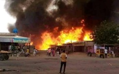 A fire rages in a livestock market in El-Fasher, in the aftermath of RSF bombing