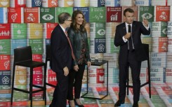 Melinda French Gates, pictured in 2018 with Bill Gates (left) and French President Emmanuel Macron, has pledged to use her fortune to help women and families 