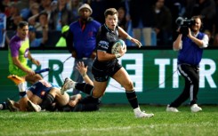 Glasgow Warriors centre Huw Jones scores the try that won the United Rugby Championship final against the Bulls in Pretoria.  