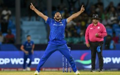 Afghanistan's Gulbadin Naib celebrates after the dismissal of  Australia's Glenn Maxwell during the T20 World Cup Super Eights match on Saturday.