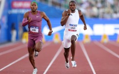 Reigning world champion Noah Lyles, right, won his preliminary heat over Kyree King, left, and other rivals at the US Olympic athletics trials to qualify for Sunday's semi-finals in Eugene, Oregon