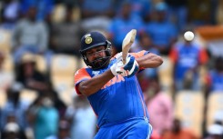 On the attack: India captain Rohit Sharma hits a four during his 92 against Australia in a T20 World Cup Super Eights match in St. Lucia