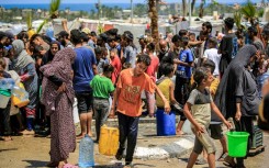 Gazans filling up water in Rafah, the southern city Israel described as Hamas's last stronghold