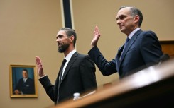 US Olympic swimming legend Michael Phelps (L) and US Anti-Doping Agency chief executive Travis Tygart are sworn in before testimony before a US congressional committee