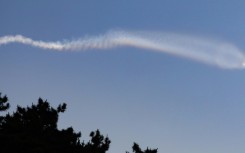 A vapour trail believed to be created by a North Korean ballistic missile is seen from South Korea's Yeonpyeong island on Wednesday