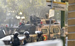 A soldier in an armored vehicle is deployed outside the Quemado Palace at Plaza Murillo in La Paz on June 26, 2024