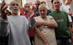 Palestinians who had been detained by Israel arrive for a check-up at Gaza's Al-Aqsa Martyrs Hospital in Deir al-Balah