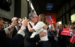 Starmer kissed his wife Victoria during a victory rally at the Tate Modern in London 