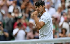 Champion: Carlos Alcaraz celebrates winning against Mark Lajal in the first round 