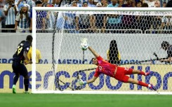 Argentina goalkeeper Emi Martinez saves from Ecuador's Alan Minda in Thursday's Copa America quarter-final thriller