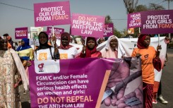 Protesters against female genital mutilation rally outside The Gambia's National Assembly