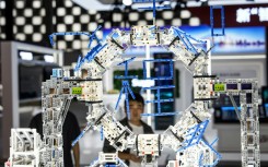 A man looks at a display at the artificial intelligence conference in Shanghai