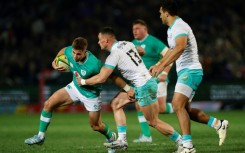 South Africa centre Jesse Kriel (2nd L) tackles Ireland fly-half Jack Crowley during the first Test in Pretoria. 