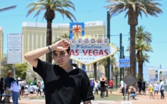 A man walks near the Las Vegas strip during a heatwave in Las Vegas, Nevada, on July 7, 2024