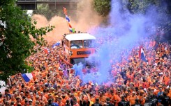 Dutch fans cheer in the streets of Dortmund ahead of Netherlands' Euro 2024 semi-final clash with England