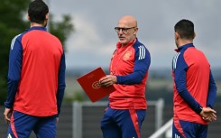 Spain coach Luis de la Fuente (C) wants his "brilliant" side to make history by winning a fourth Euros trophy