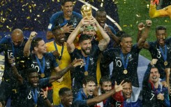 Olivier Giroud holds aloft the World Cup trophy in 2018