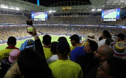 Ticketed fans were forced to watch Sunday's Copa America final from stadium walkways after supporters without tickets stormed into the venue