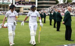 Undefeated: England's Harry Brook (L) and Joe Root return to the pavilion after an unbroken century stand in the second Test against the West Indies at Trent Bridge  