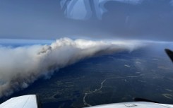 A July 12, 2024 aerial view of a wildfire near Canada's northeastern town of Wabush