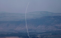 A rocket fired from southern Lebanon is intercepted by Israel's Iron Dome air defence system over northern Israel