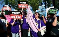 Disney employees rally outside the main entrance of Disneyland Resort in Anaheim, California, on July 17, 2024, ahead of a planned strike authorization vote