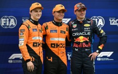 Max Verstappen (right) was overshadowed by the McLaren men in qualifying for Sunday's Hungarian Grand Prix 